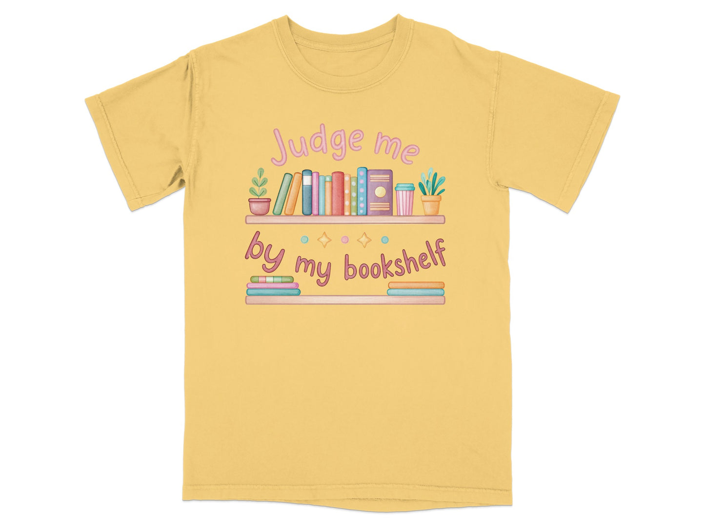 Yellow t-shirt with "Judge me by my bookshelf" and a colorful bookshelf illustration.