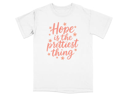 White t-shirt with "Hope is the prettiest thing" text and small floral accents.