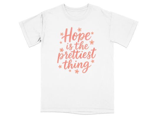 White t-shirt with "Hope is the prettiest thing" text and small floral accents.