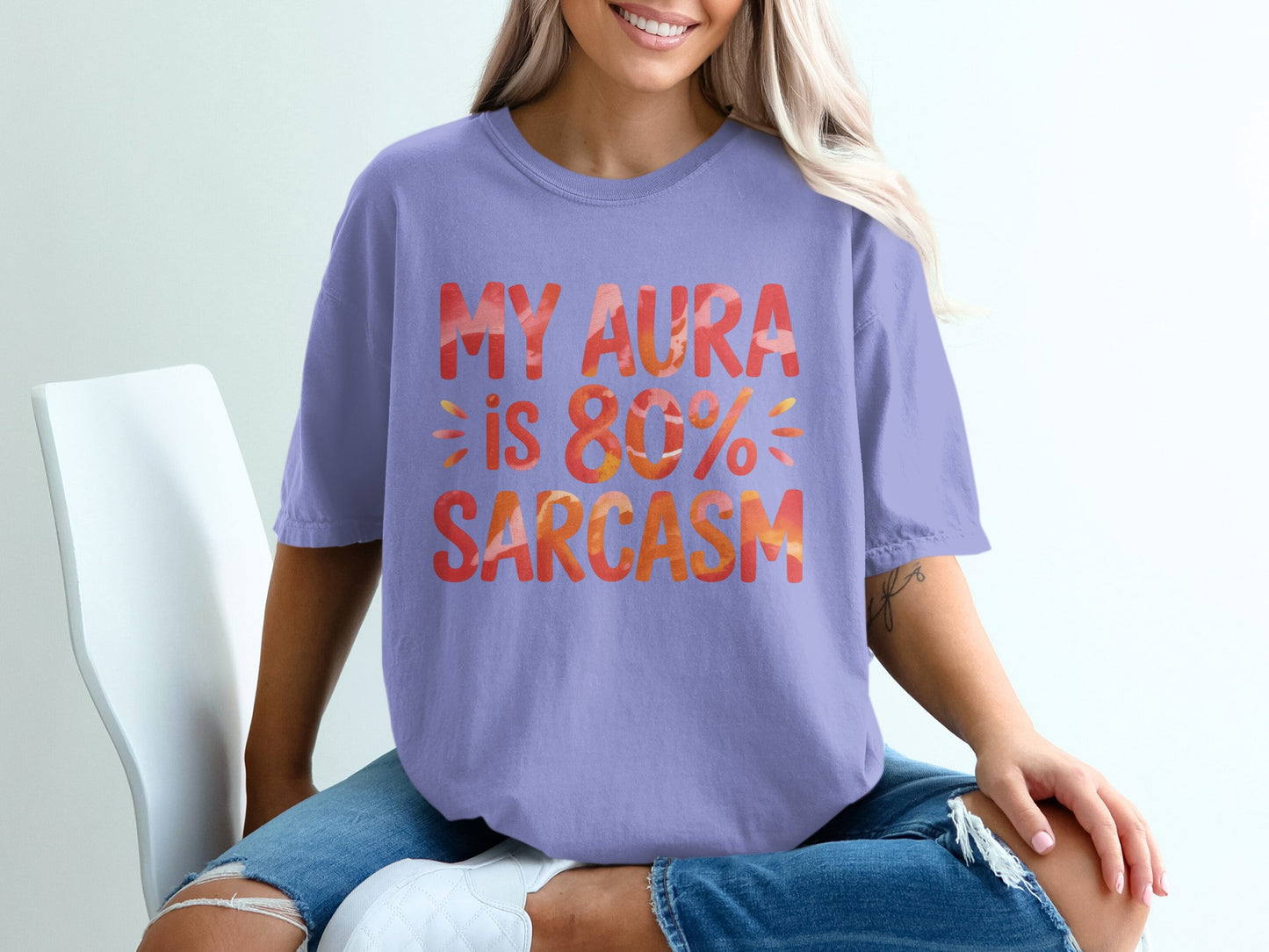 Purple t-shirt with "MY AURA IS 80% SARCASTIC" in orange and yellow text.