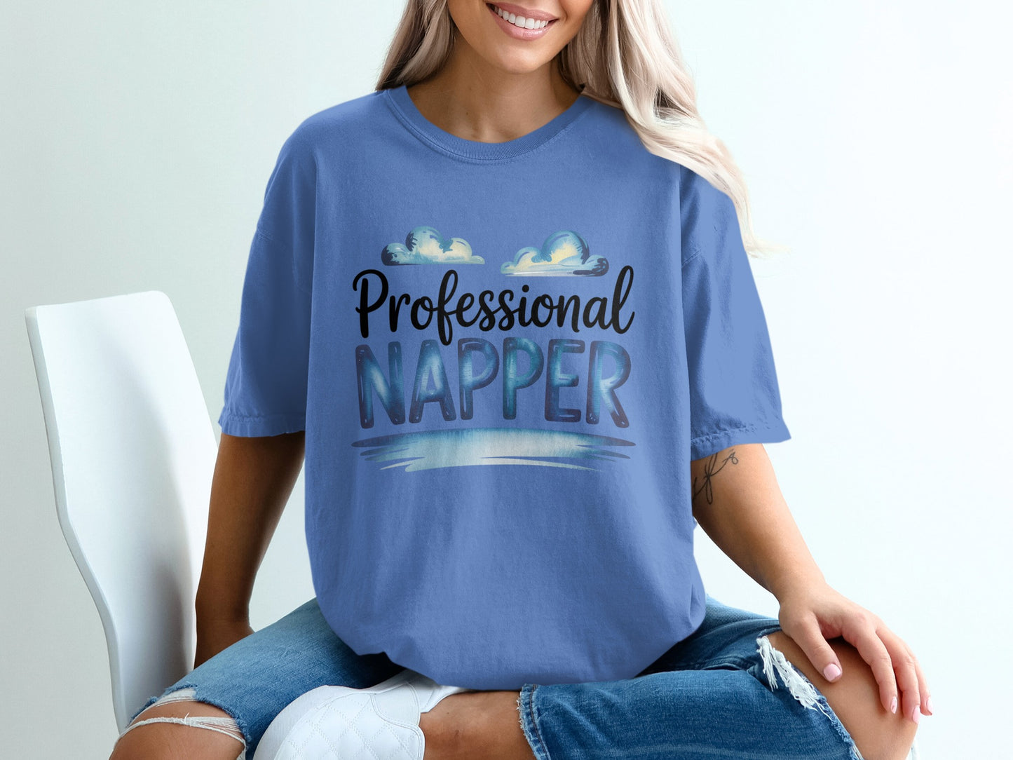 Blue t-shirt with "Professional Napper" text and cloud design.