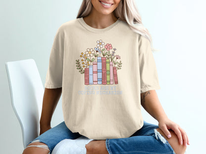 T-shirt with books and flowers and text "Books are my coping mechanism."