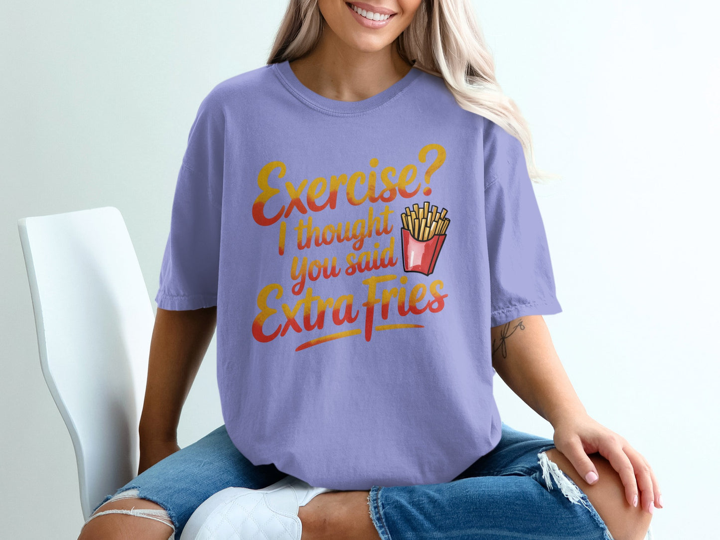 Purple t-shirt with "Exercise? I thought you said Extra Fries" graphic.