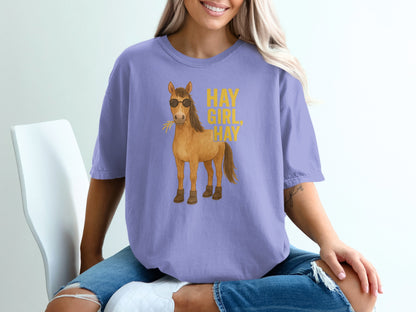 Lavender t-shirt with sunglasses-wearing cartoon horse and text "HAY GIRL HAY".