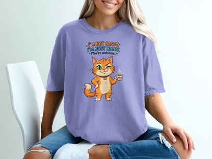 Lavender t-shirt with illustrated cat holding coffee cup, text "I'm not sassy. I'm just right."