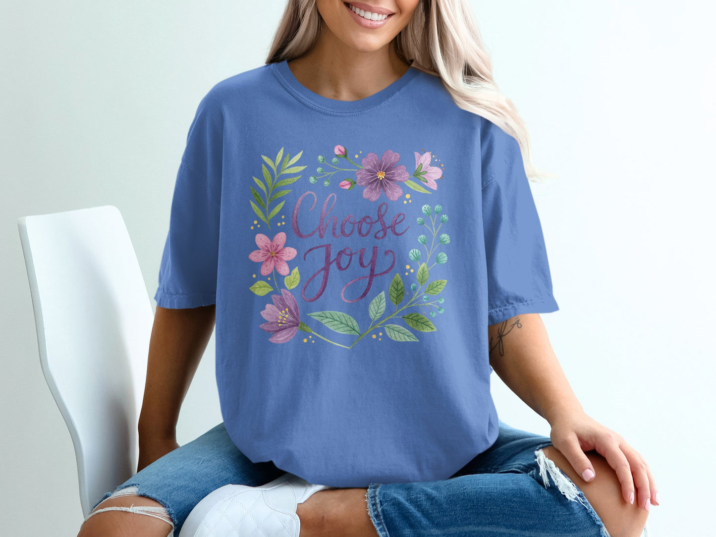 Purple t-shirt with floral wreath and "Choose Joy" text.