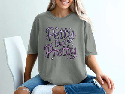 Grey t-shirt with "Petty But Pretty" text in purple gradient lettering.