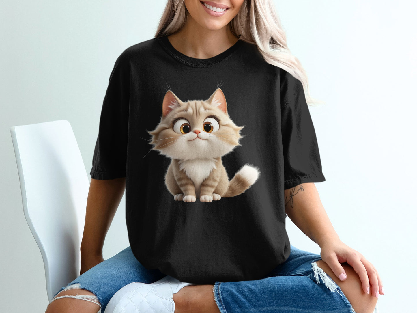 Black t-shirt with cartoon cat graphic.