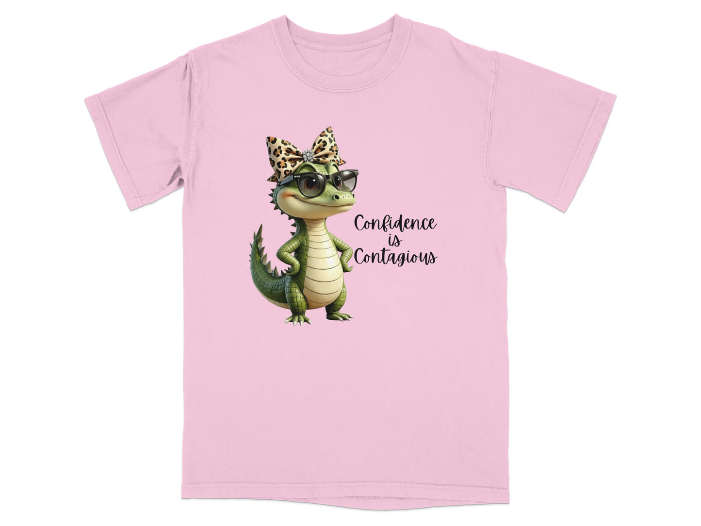 Pink t-shirt with cartoon alligator wearing sunglasses and leopard print bow, "Confidence is Contagious" text.