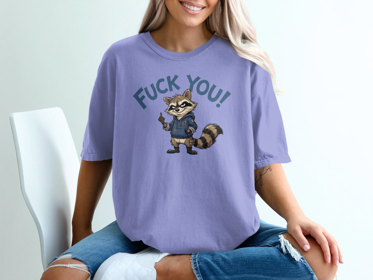 T-shirt with raccoon graphic and "FUCK YOU!" text.