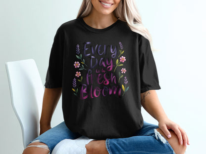 Black t-shirt with "Every Day is a Fresh Bloom" text and floral accents.