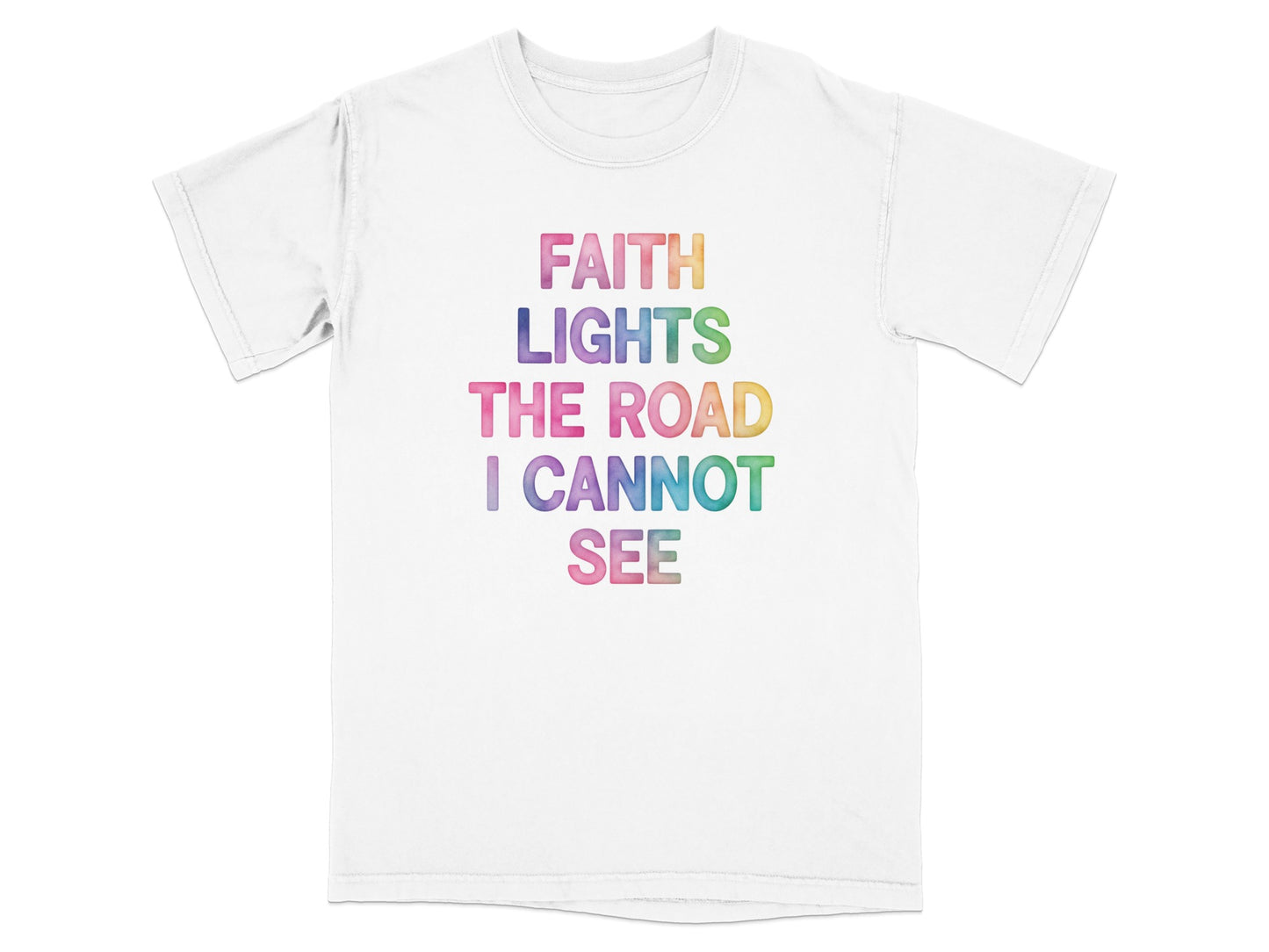 White t-shirt with rainbow text "FAITH LIGHTS THE ROAD I CANNOT SEE".