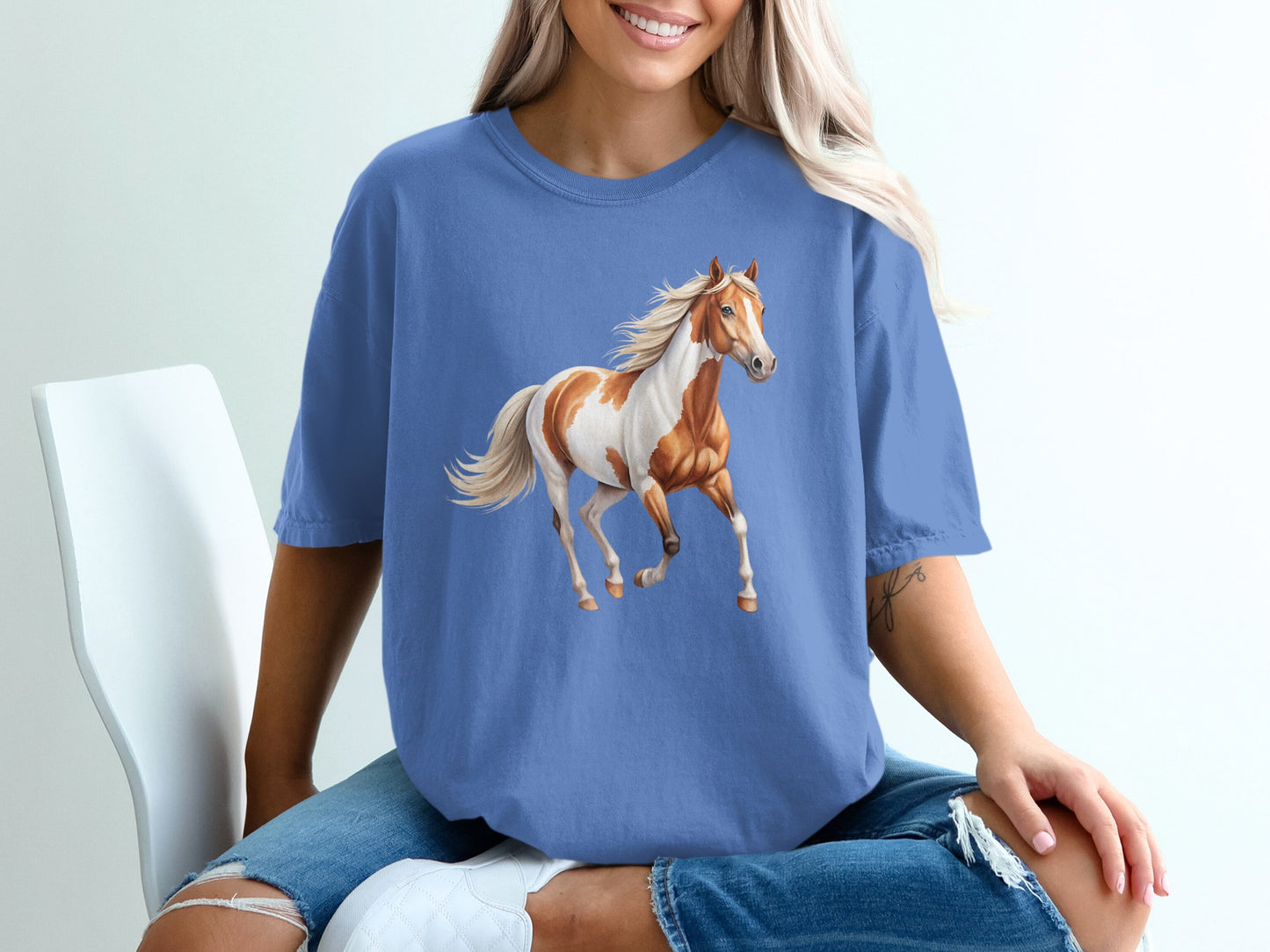 T-shirt with a chestnut and white horse running.