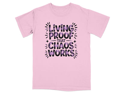 Pink t-shirt with "Living Proof That Chaos Works" in purple text.