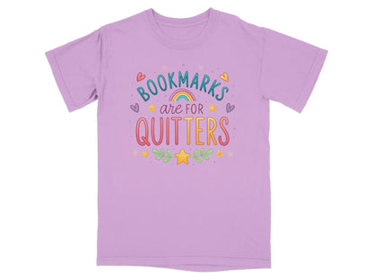 Purple t-shirt with "Bookmarks are for quitters" text and playful illustrations.