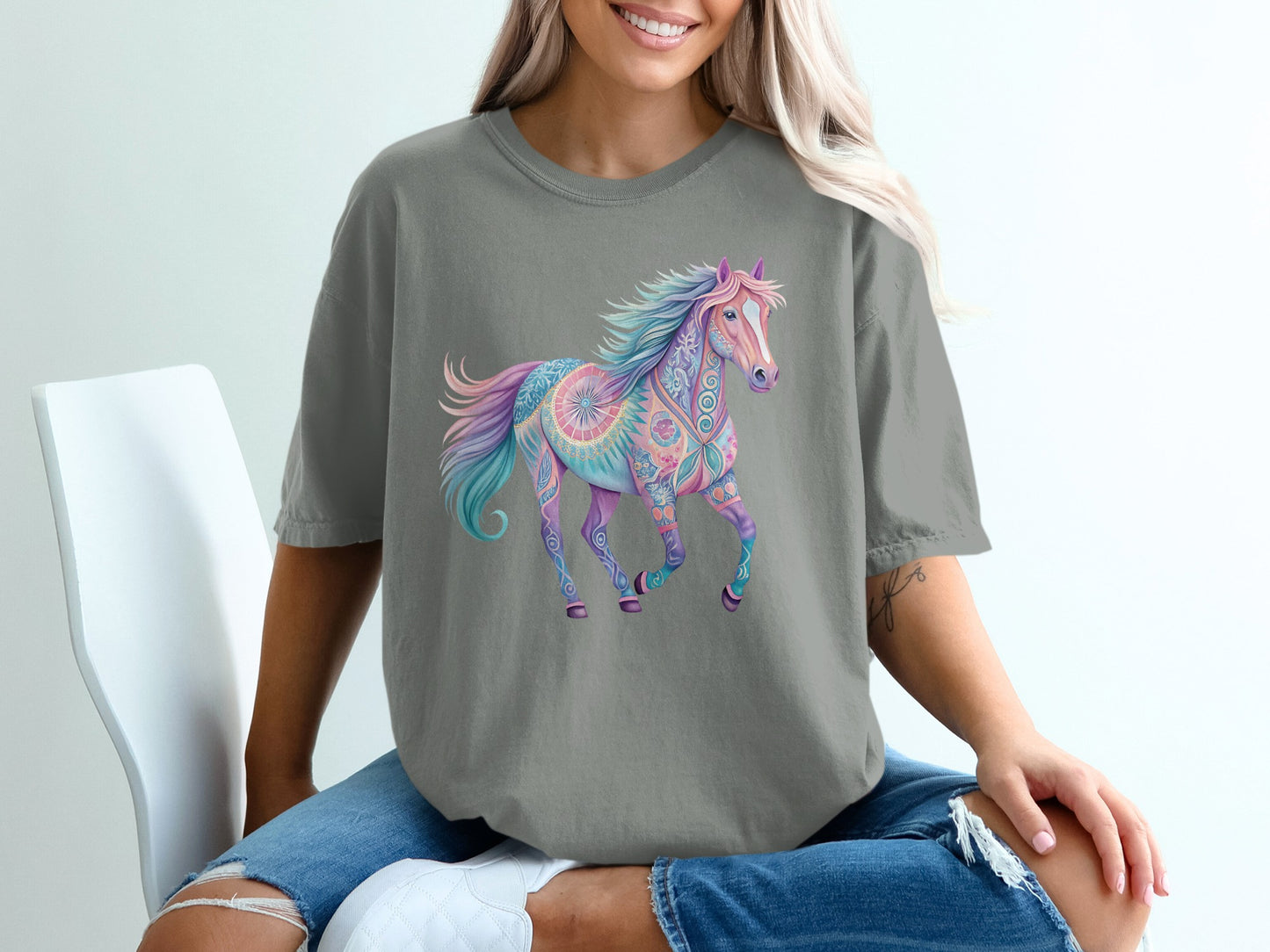 T-shirt with a colorful, patterned horse graphic.