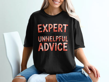Black t-shirt with "EXPERT IN UNHELPFUL ADVICE" text in red and orange.