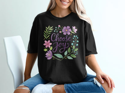 Black t-shirt with "Choose Joy" text surrounded by floral and leafy design.