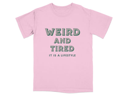 Pink t-shirt with "WEIRD AND TIRED IT IS A LIFESTYLE" text.
