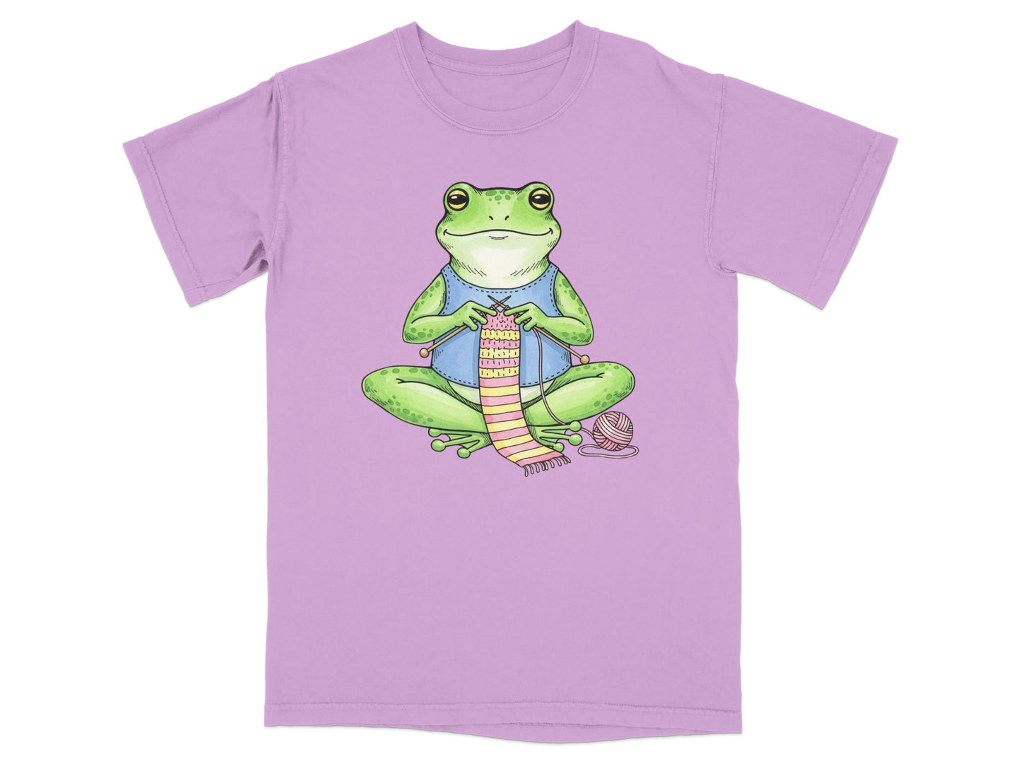 Frog knitting a striped scarf, wearing a blue vest.