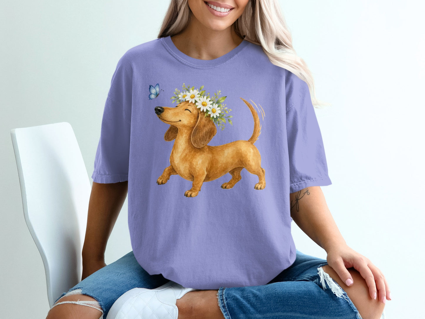 Dachshund wearing a flower crown with a butterfly.