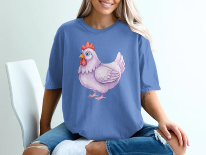 Purple t-shirt with a watercolor hen graphic on chest.