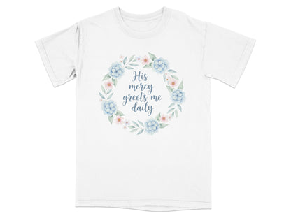 White t-shirt with floral wreath and text "His mercy greets me daily".