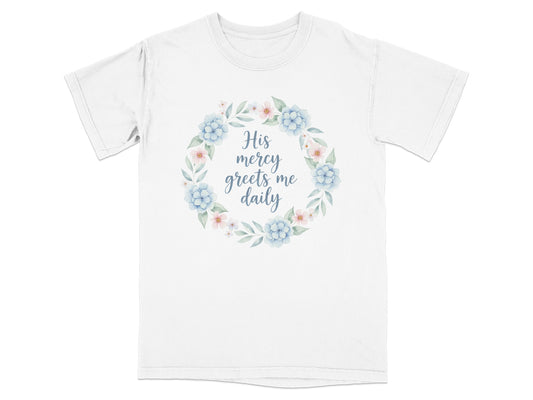 White t-shirt with floral wreath and text "His mercy greets me daily".