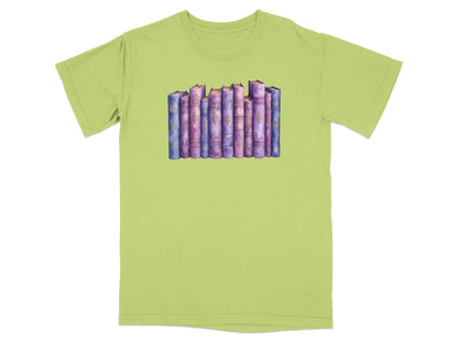 T-shirt with a watercolor illustration of a row of colorful books.