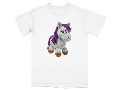 White t-shirt featuring a crocheted gray horse with purple mane and brown hooves.