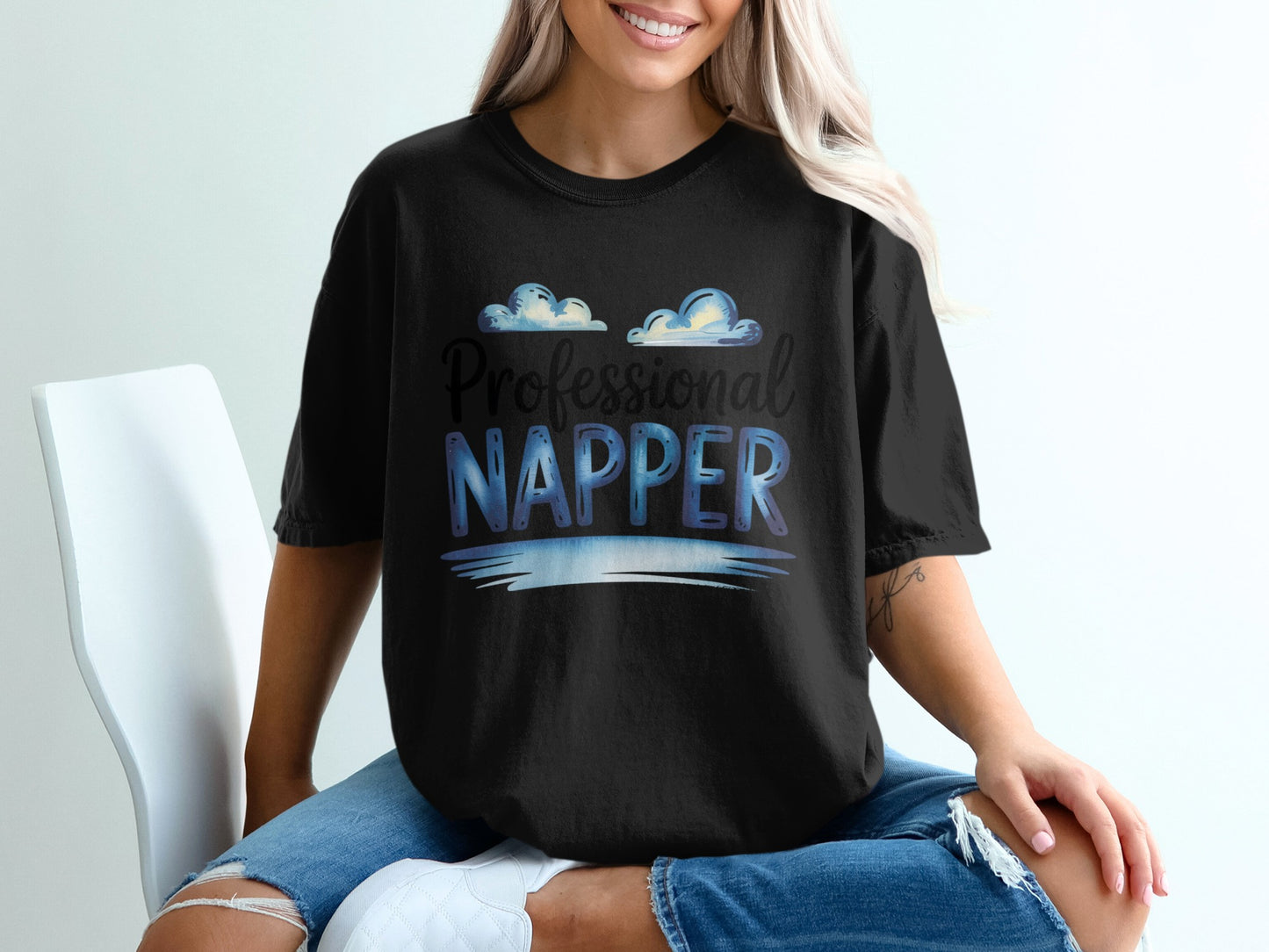 Black t-shirt with "Professional Napper" and cloud graphics.