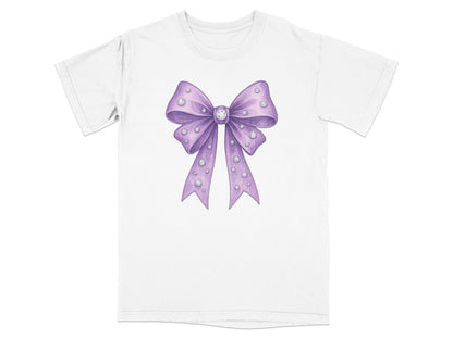 Purple bow with diamonds on a white t-shirt.