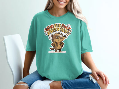 Teal t-shirt with cartoon badger asking "Who the f*** asked you?!"