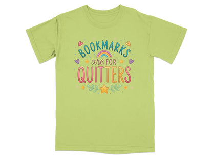 Light green t-shirt with "Bookmarks are for quitters" text and colorful decorations.