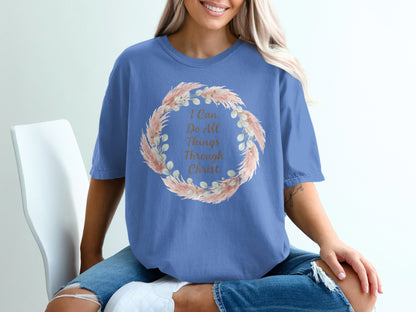 Blue t-shirt with floral wreath and text "I Can Do All Things Through Christ".