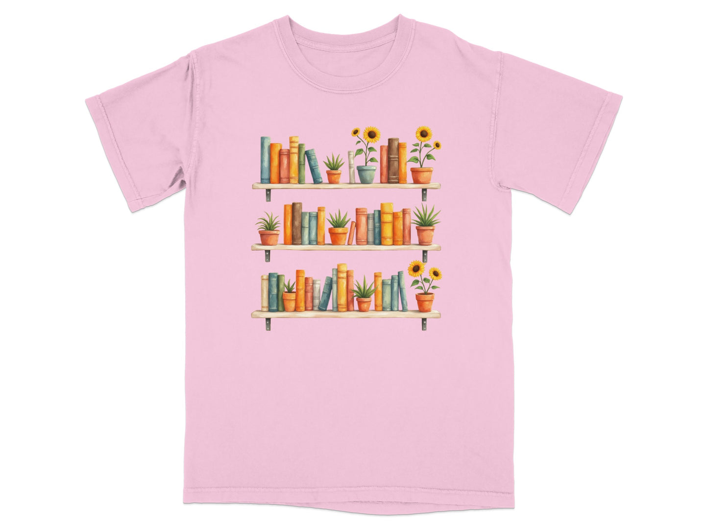 Pink t-shirt with a watercolor illustration of three bookshelves filled with books and potted plants.