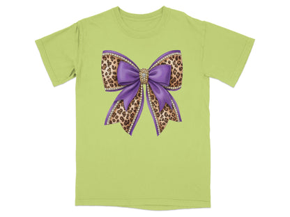 Green t-shirt with a large purple and leopard print bow design.