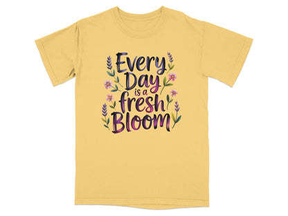 Yellow t-shirt with "Every Day is a Fresh Bloom" text and floral design.