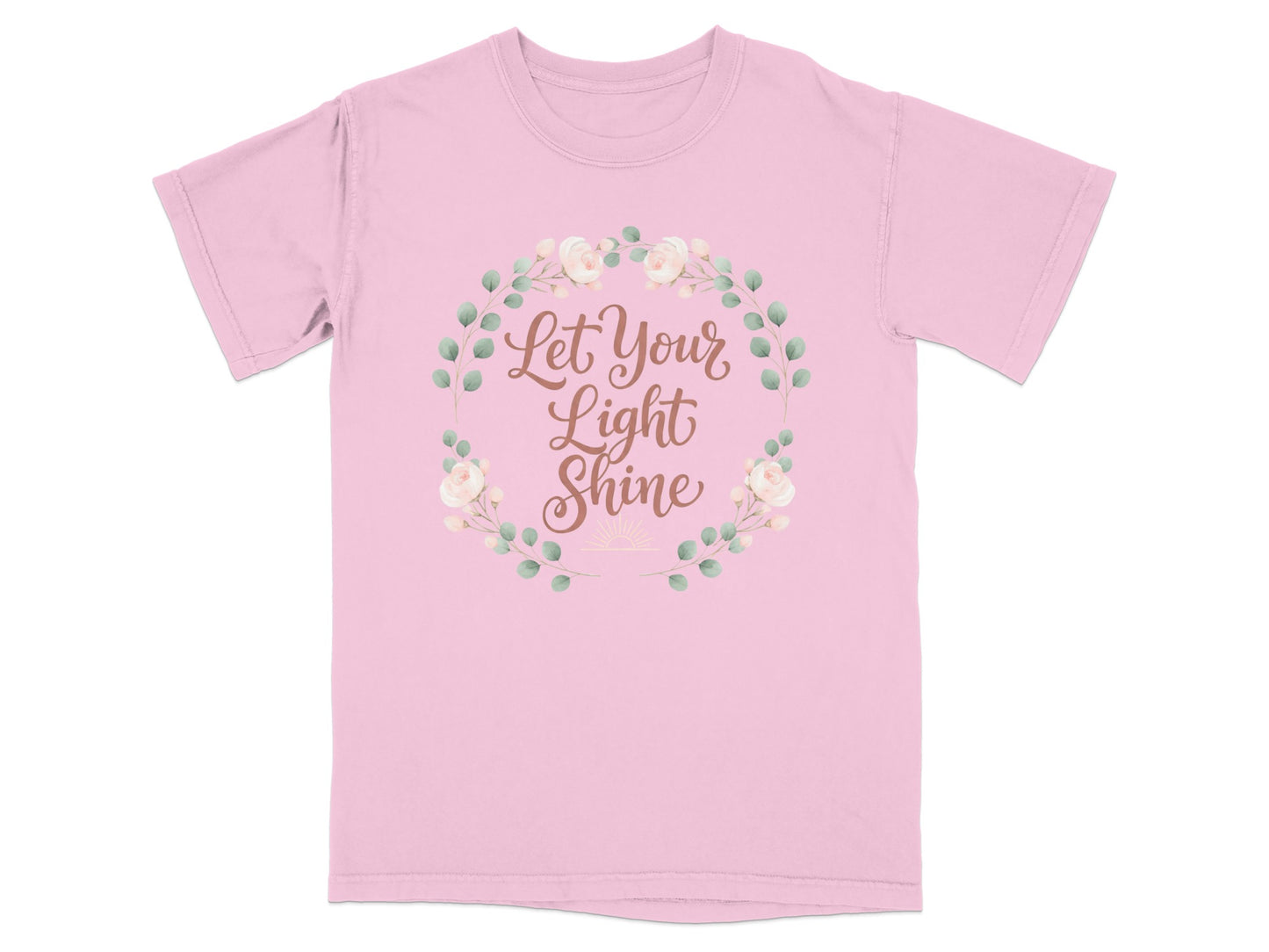 Pink t-shirt with "Let Your Light Shine" text inside a floral wreath.