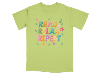 Light green t-shirt with "Read Relax Repeat" text and floral accents.