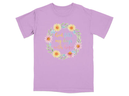 Purple t-shirt with floral wreath and "God fills my days with hope" text.
