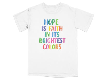 White t-shirt with "Hope is Faith in its Brightest Colors" in colorful text.