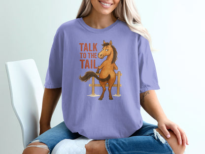 Purple t-shirt with cartoon horse and "Talk to the tail" text.