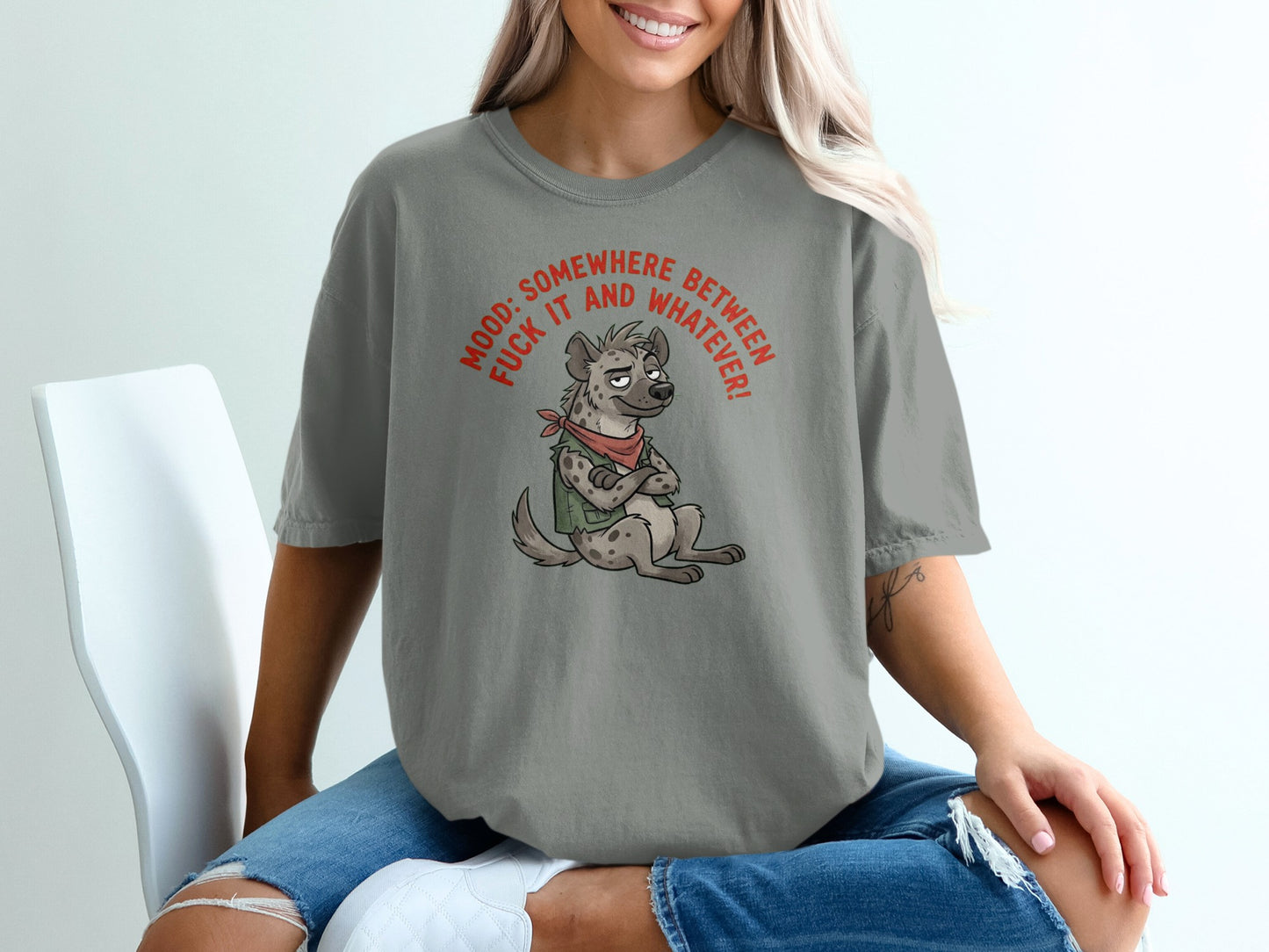 Grey t-shirt with cartoon hyena wearing bandana, text "MOOD: SOMEWHERE BETWEEN FUCK IT AND WHATEVER!"