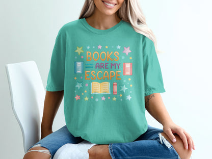 Teal t-shirt with "Books Are My Escape" in colorful lettering and book graphics.