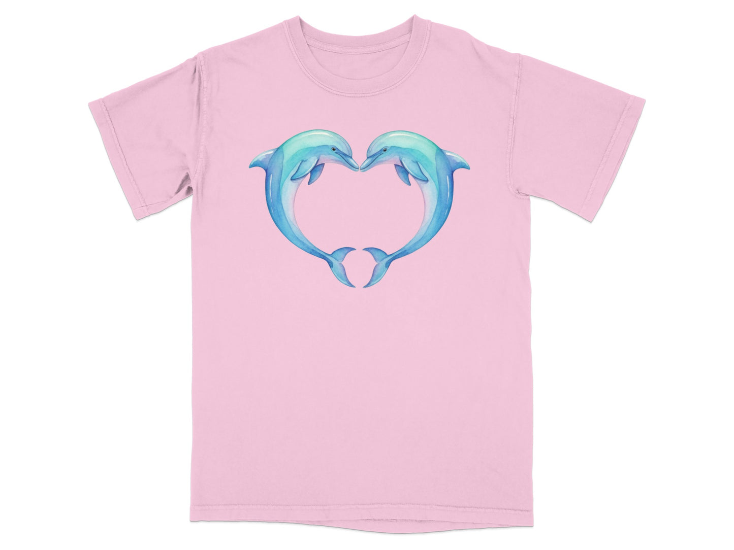 Two dolphins forming a heart shape on a light pink t-shirt.