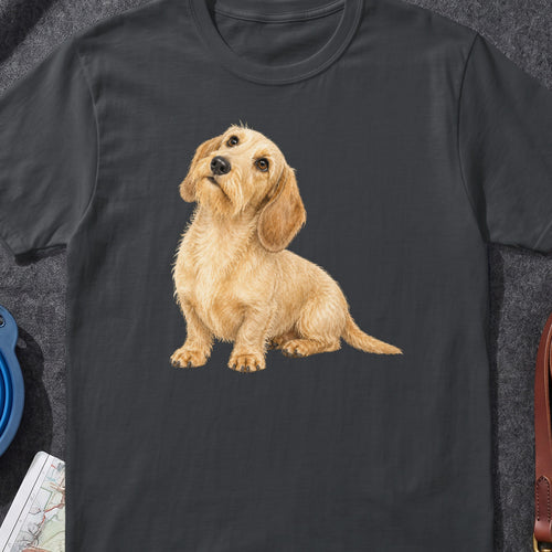 T-shirt with watercolor illustration of a shaggy blonde dachshund looking up attentively.