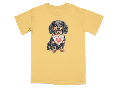 Dachshund wearing a red bandana with hearts, printed on a yellow t-shirt.