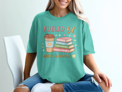 Teal t-shirt with books and coffee graphic, "Fueled by Books & Coffee" text.