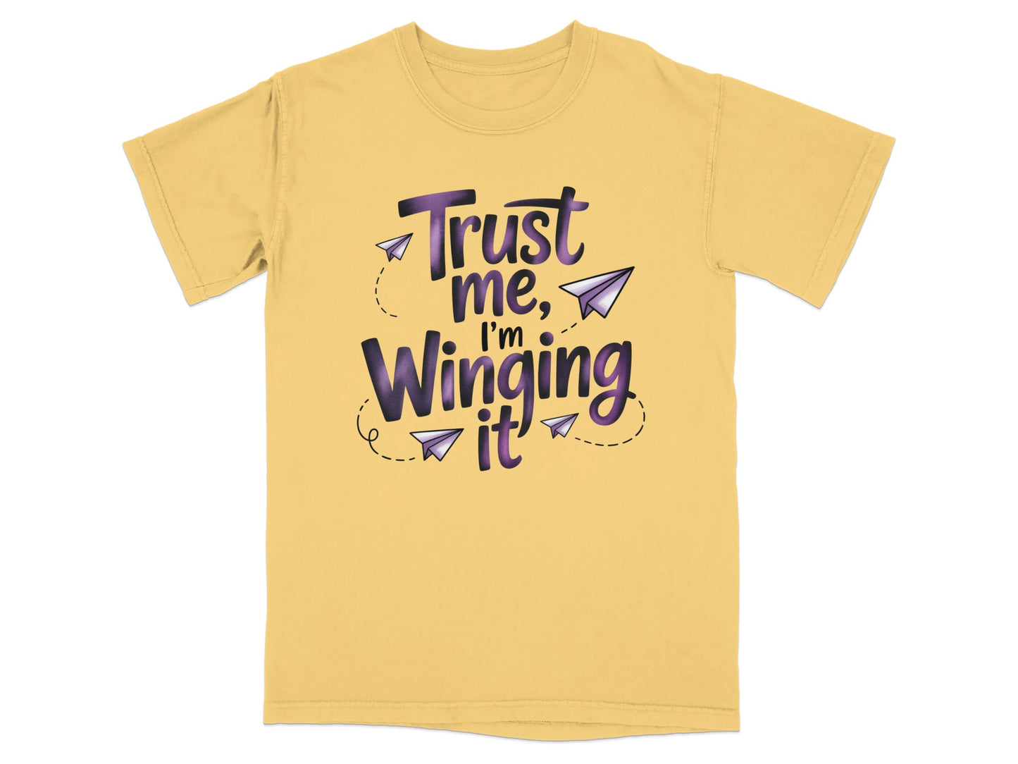 Yellow t-shirt with purple text "Trust me, I'm Winging It!" and paper airplanes.